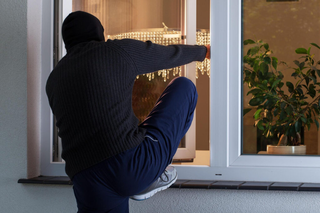A thief trying to come inside through window- california castle doctrine