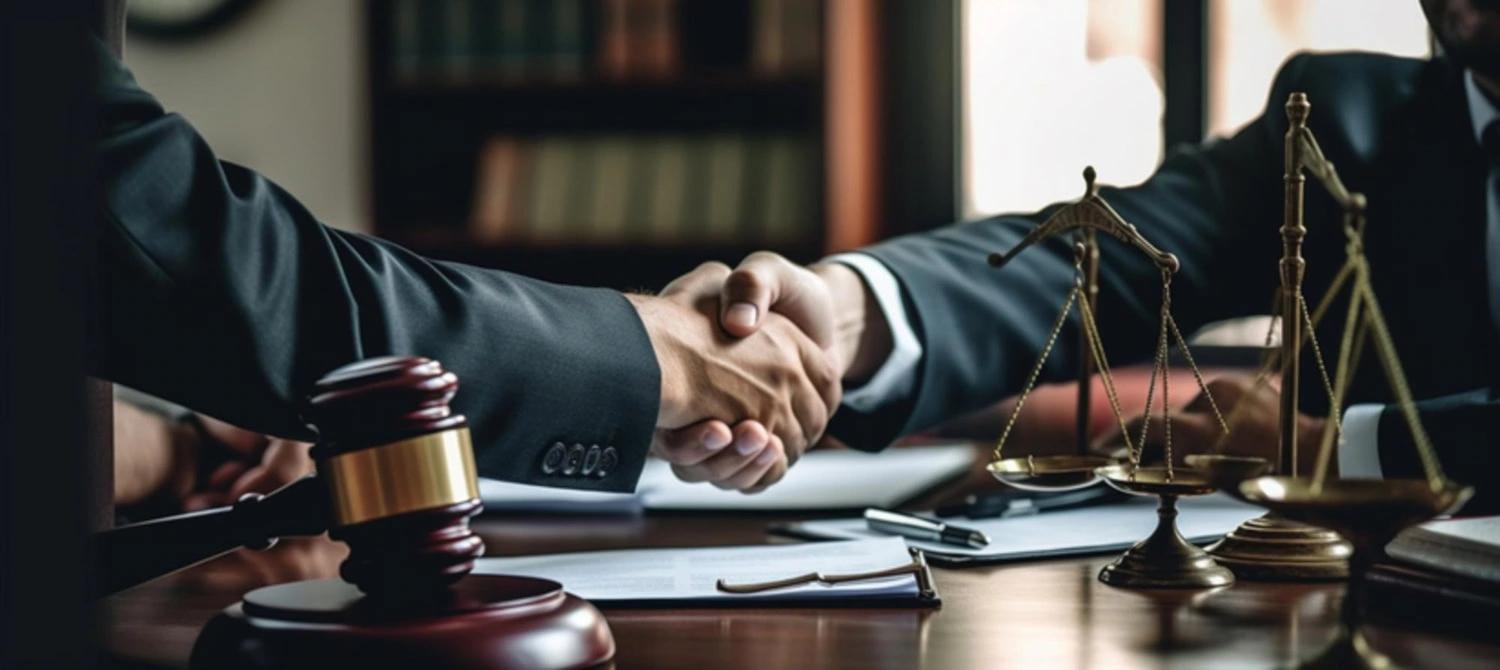 lawyer and the client shaking hands-