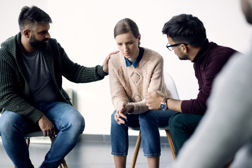 A victim of harassment receiving comfort and support.